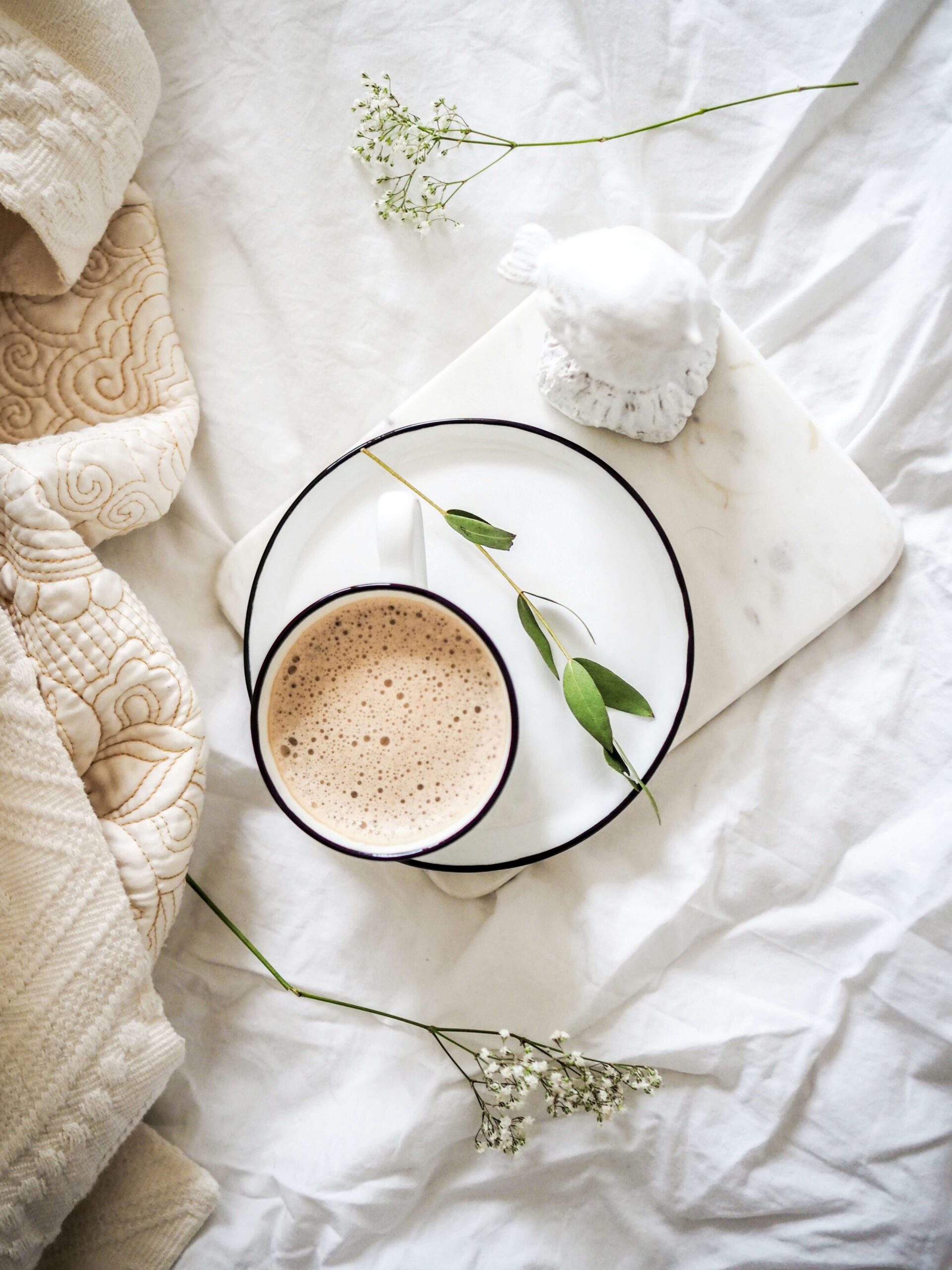 Self-Care in bed with a coffee